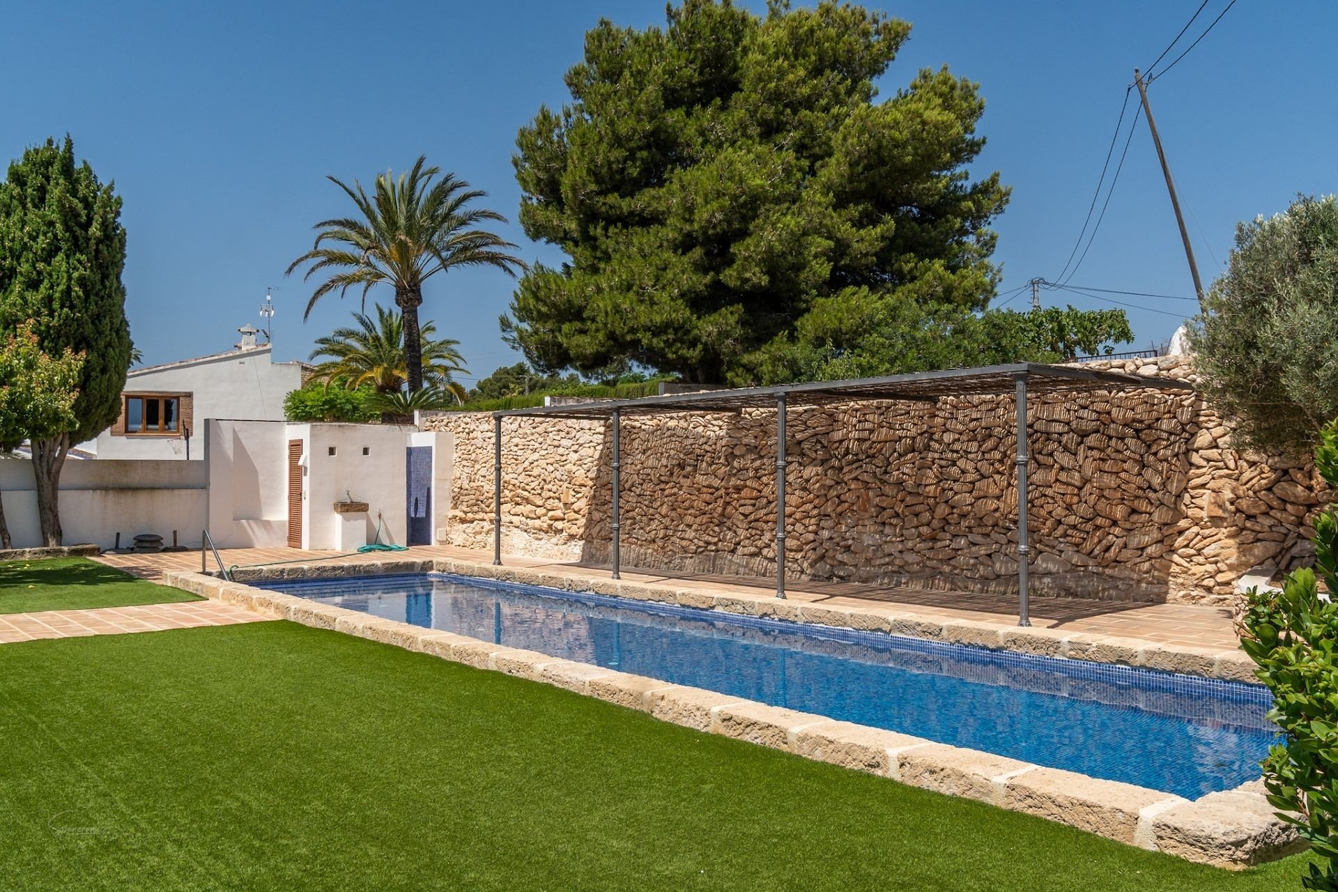 Heated saltwater swimming pool surrounded by terraces