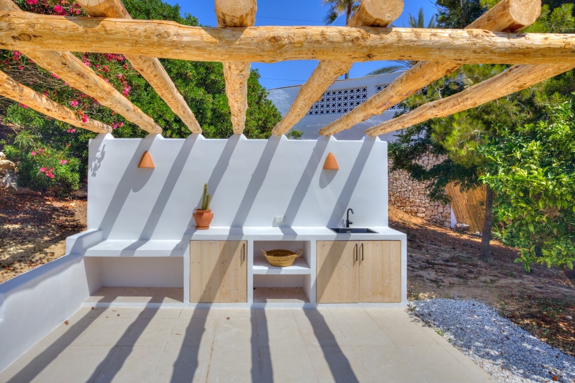 Mediterranean outdoor living terrace with summer kitchen in San Jaime
