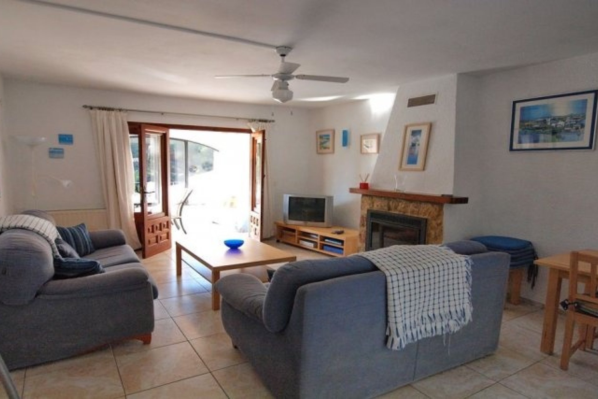 Villa in El Portet, woonkamer met open haard 