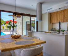 Modern living room in a Benimeit villa with large windows and Mediterranean views